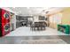 Open floorplan featuring stainless steel appliances, grey cabinetry, tile floors, and direct dining room access at 1328 Balzar Ave, Las Vegas, NV 89106