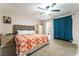 Well-lit main bedroom with a large bed, neutral walls, and access to an ensuite bathroom at 1328 Balzar Ave, Las Vegas, NV 89106