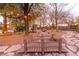 Landscaped backyard featuring mature trees, a charming bridge, and a peaceful water feature at 1561 Doran Dr, Las Vegas, NV 89123
