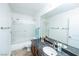 Clean bathroom with a dark countertop and shower featuring a sliding glass door at 1561 Doran Dr, Las Vegas, NV 89123