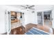 Bright bedroom featuring hardwood floors, ceiling fan, and doors leading to the backyard at 1561 Doran Dr, Las Vegas, NV 89123