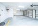 Spacious two-car garage with a white door and ample storage space at 1561 Doran Dr, Las Vegas, NV 89123
