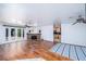 Bright living room featuring hardwood floors, brick fireplace, and French doors to backyard at 1561 Doran Dr, Las Vegas, NV 89123