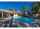 Sparkling pool surrounded by lush landscaping, creating a private backyard oasis at 1561 Doran Dr, Las Vegas, NV 89123