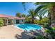 Beautiful backyard pool and patio with tropical landscaping, perfect for relaxing or entertaining at 1561 Doran Dr, Las Vegas, NV 89123