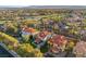 A picturesque neighborhood aerial view highlighting a beautiful home near the golf course and a tranquil pond at 1905 Iron Ridge Dr, Las Vegas, NV 89117