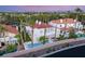 An elevated view showcases a beautiful home with a private backyard pool and patio and lush landscaping at 1905 Iron Ridge Dr, Las Vegas, NV 89117
