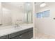 Bathroom with neutral tones and dark-gray vanity at 1905 Iron Ridge Dr, Las Vegas, NV 89117