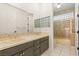 The bathroom has a double vanity and tile flooring at 1905 Iron Ridge Dr, Las Vegas, NV 89117