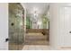 Bathroom with large marble shower and separate marble step up tub at 1905 Iron Ridge Dr, Las Vegas, NV 89117