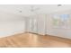 Bright bedroom with hardwood floors and large windows with white shutters at 1905 Iron Ridge Dr, Las Vegas, NV 89117