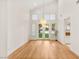 Bright dining area with hardwood floors, large windows with shutters, and modern lighting fixtures at 1905 Iron Ridge Dr, Las Vegas, NV 89117