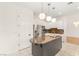 Modern kitchen with stainless steel appliances, stylish lighting, and a functional center island at 1905 Iron Ridge Dr, Las Vegas, NV 89117
