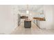 Bright open kitchen with a central island, modern appliances, and sleek cabinetry at 1905 Iron Ridge Dr, Las Vegas, NV 89117