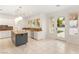 Bright kitchen with stainless appliances, granite countertops and access to the backyard at 1905 Iron Ridge Dr, Las Vegas, NV 89117