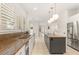 Modern kitchen with granite countertops, stainless steel appliances, and ample cabinet space at 1905 Iron Ridge Dr, Las Vegas, NV 89117