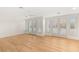 Well-lit living room with hardwood floors and large windows with white shutters at 1905 Iron Ridge Dr, Las Vegas, NV 89117