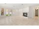 Open living area with tile floors, a fireplace, and natural light from french doors at 1905 Iron Ridge Dr, Las Vegas, NV 89117