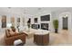 Spacious living room featuring modern furniture, fireplace, neutral tones, and plenty of natural light at 1905 Iron Ridge Dr, Las Vegas, NV 89117