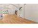Open-concept living area featuring hardwood floors and staircase at 1905 Iron Ridge Dr, Las Vegas, NV 89117