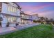 View of the home's exterior showcasing a spacious backyard with well-manicured lawn at 1987 Orchard Mist St, Las Vegas, NV 89135