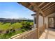 Balcony view of a lush green golf course and mountains in the background at 1987 Orchard Mist St, Las Vegas, NV 89135