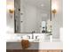 Bathroom vanity featuring modern fixtures, lighting and a large mirror at 1987 Orchard Mist St, Las Vegas, NV 89135