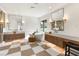 Primary bath showcasing dual vanities, freestanding tub, checkered floors, and modern fixtures at 1987 Orchard Mist St, Las Vegas, NV 89135