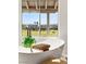 Bathroom tub with a view of the neighborhood and golf course at 1987 Orchard Mist St, Las Vegas, NV 89135