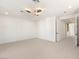 Spacious bedroom with neutral carpet, ceiling fan, and ample natural light at 1987 Orchard Mist St, Las Vegas, NV 89135