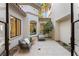 Charming courtyard with comfortable seating and tasteful landscaping, perfect for outdoor relaxation at 1987 Orchard Mist St, Las Vegas, NV 89135