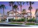 Elegant home exterior with professional landscaping and a welcoming entrance at twilight at 1987 Orchard Mist St, Las Vegas, NV 89135