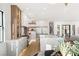 Bright kitchen with a marble island, stainless appliances, and a view into the open living space at 1987 Orchard Mist St, Las Vegas, NV 89135