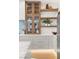 Elegant kitchen boasts custom cabinets, open shelving, and premium finishes at 1987 Orchard Mist St, Las Vegas, NV 89135