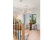 Bright living area boasts modern lighting, stylish bar, and views from updated black frame windows at 1987 Orchard Mist St, Las Vegas, NV 89135
