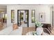 Inviting living room with large windows offering natural light with views into the courtyard at 1987 Orchard Mist St, Las Vegas, NV 89135