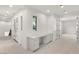 Well-lit office space with built-in desk, cabinets, and neutral carpeting at 1987 Orchard Mist St, Las Vegas, NV 89135