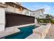 The backyard features a stunning pool, spa, and privacy shade feature at 1987 Orchard Mist St, Las Vegas, NV 89135