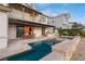 The backyard features a stunning pool, spa and outdoor dining, with seamless indoor-outdoor living at 1987 Orchard Mist St, Las Vegas, NV 89135