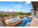 Luxury pool and spa featuring picturesque backyard with lush green landscape at 1987 Orchard Mist St, Las Vegas, NV 89135