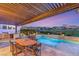 Beautiful pool and spa with outdoor kitchen and dining space at 1987 Orchard Mist St, Las Vegas, NV 89135