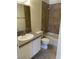 Well-lit bathroom includes a shower-tub combo with tiled backsplash at 220 Mission Catalina Ln # 203, Las Vegas, NV 89107