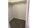 Walk-in closet with carpeted floor and hanging rack for organized storage at 220 Mission Catalina Ln # 203, Las Vegas, NV 89107