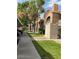 Exterior building view, showing parking, landscaping, sidewalks and stairways to the upper units at 220 Mission Catalina Ln # 203, Las Vegas, NV 89107