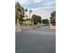 Community gate providing security and privacy with mature landscaping and well-maintained grounds visible within at 220 Mission Catalina Ln # 203, Las Vegas, NV 89107
