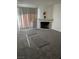 Spacious living room includes a fireplace and large window for plenty of light at 220 Mission Catalina Ln # 203, Las Vegas, NV 89107