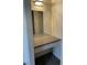 Vanity area with a mirror, drawer, light fixture, and gray countertop at 220 Mission Catalina Ln # 203, Las Vegas, NV 89107