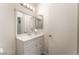 Bathroom featuring a well-lit single sink vanity with storage and a mirrored medicine cabinet at 221 Mission Catalina Ln # 104, Las Vegas, NV 89107