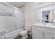 Bright bathroom featuring a shower-tub combination with sliding doors and a single sink vanity at 221 Mission Catalina Ln # 104, Las Vegas, NV 89107