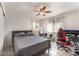 Bedroom featuring a ceiling fan, neutral walls and tile flooring at 221 Mission Catalina Ln # 104, Las Vegas, NV 89107